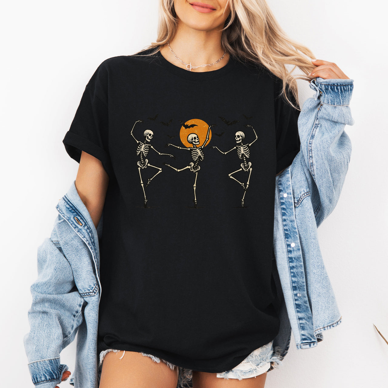 Skeleton Dancers Halloween Themed Spooky Dance Illustration With Playful Grinning Skulls Graphic Tee
